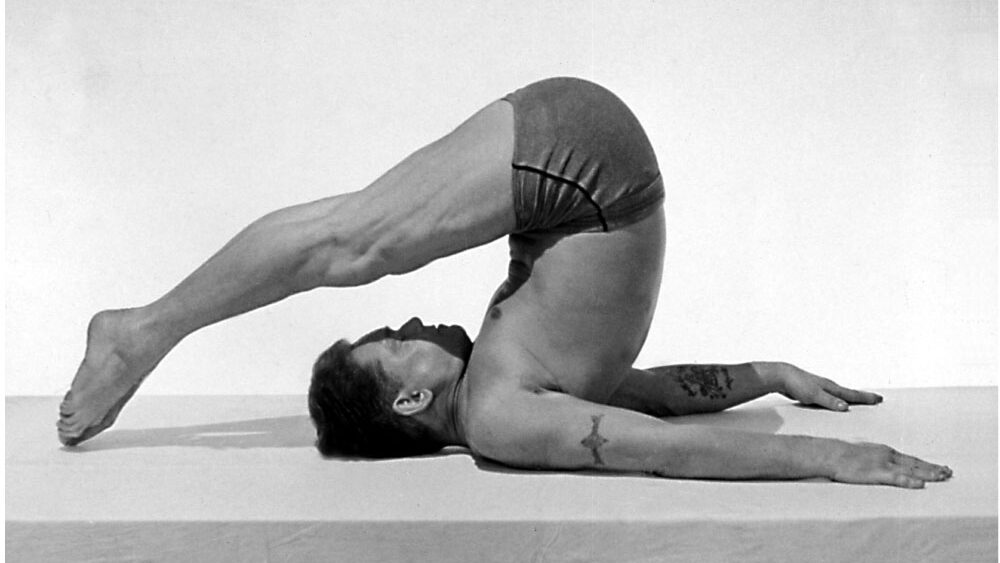 Joseph Pilates demonstrating the Rollover exercise